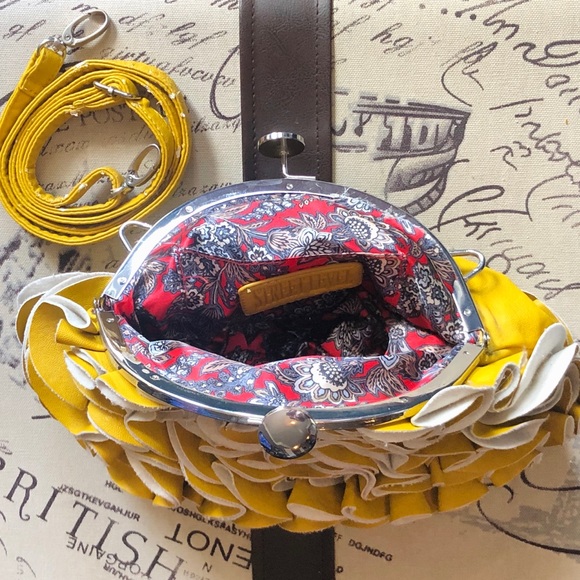 Yellow leather wave clutch with coin purse closure